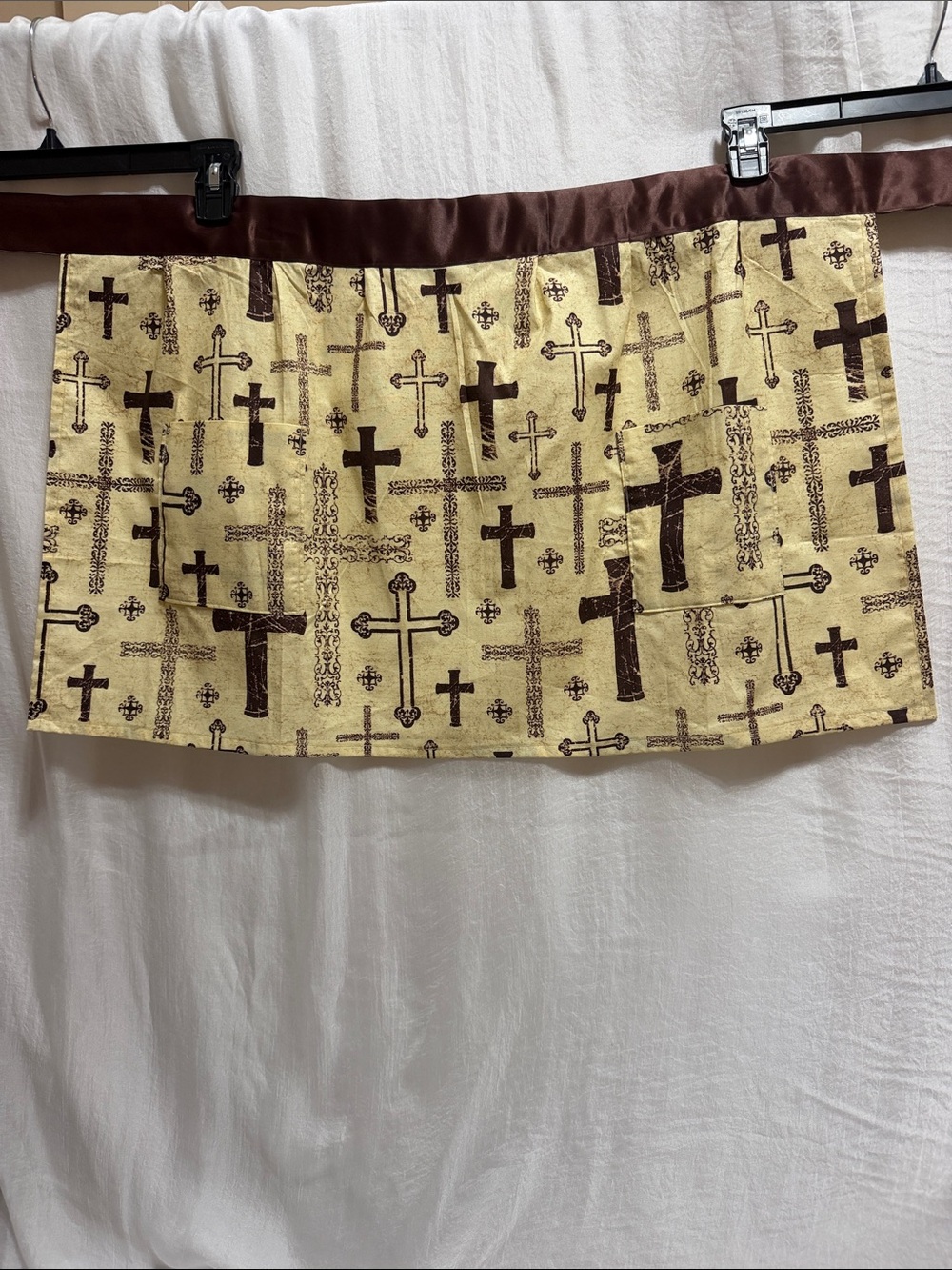 Handmade apron brown with crosses and 2 pockets.